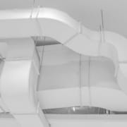 What’s in Your Ductwork? Grey ductwork traveling along a ceiling